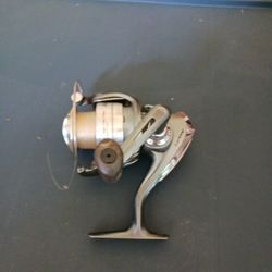 A Fishing Reel Silver And Grey