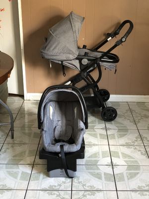 Photo PRACTICALLY NEW URBINI OMNI PLUS TRAVEL STROLLER CAR SEAT AND BASSINET 3 in 1