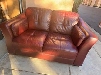 Loveseat coach leather