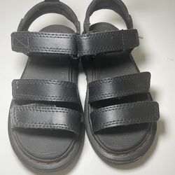 These are Dr. Martens Youth Klaire Leather Strap Sandals 