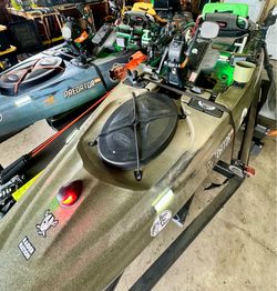 2 Old Town Predator kayaks with accessories.