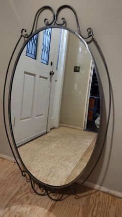Mirror with metal frame