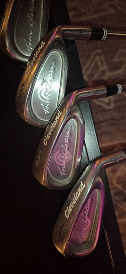 Full set of Cleveland tour action irons plus two wedges and an odyssey putter
