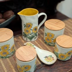 set of Dresden and Company Sunflower Pottery ceramic canisters, pitcher, and spoon rest. 