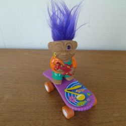 Vibtage Rock Star Troll Rides Skateboard