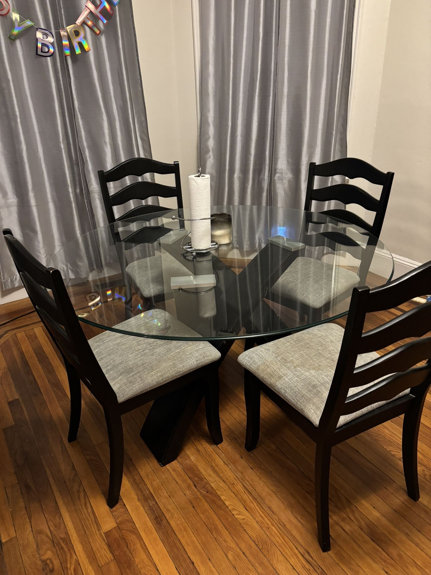 Black and gray chairs, Glass Dinning room table