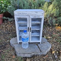 Shabby chic white cabinet.