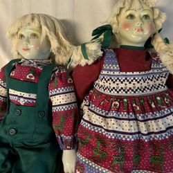 Two Orma Porcelain Christmas Dolls