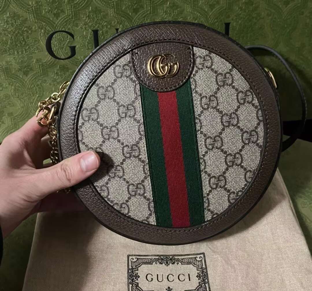 Cylindrical Ophidia ebony brown bag