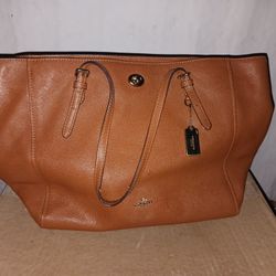 Brown COACH HAND PURSE $50