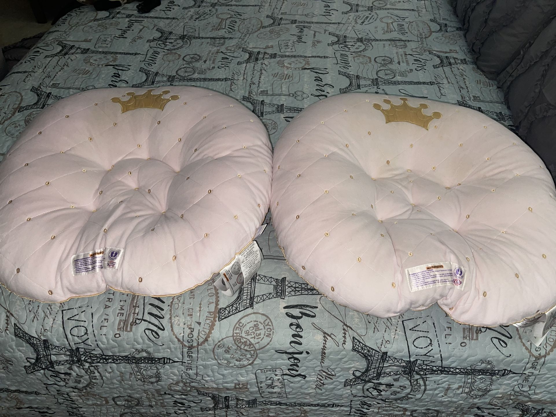 2 Baby Pillows Help Support Them When Feeding Them And When They Sleep. They Come In Handy. A lot Like New ( Light Pink Color)