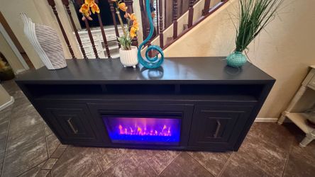 Beautiful legend fireplace /tv stand with realistic display flames 65” inches long
