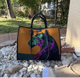 Viola Castellani tote bag in mustard and olive color .