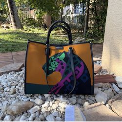 Viola Castellani tote bag in mustard and olive color .