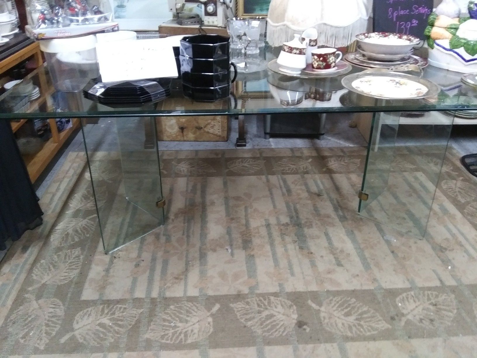 Large glass top table no chairs