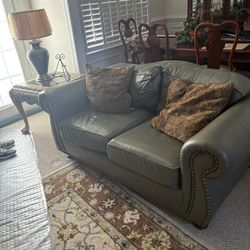 A leather sofa and a leather love seat. Two end tables and a coffee table and a sofa table. Pick up in Concord, NC
