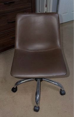 Brown faux leather chair from living spaces