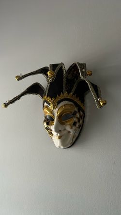 An authentic, handmade Venetian jester mask purchased directly in Venice, Italy.