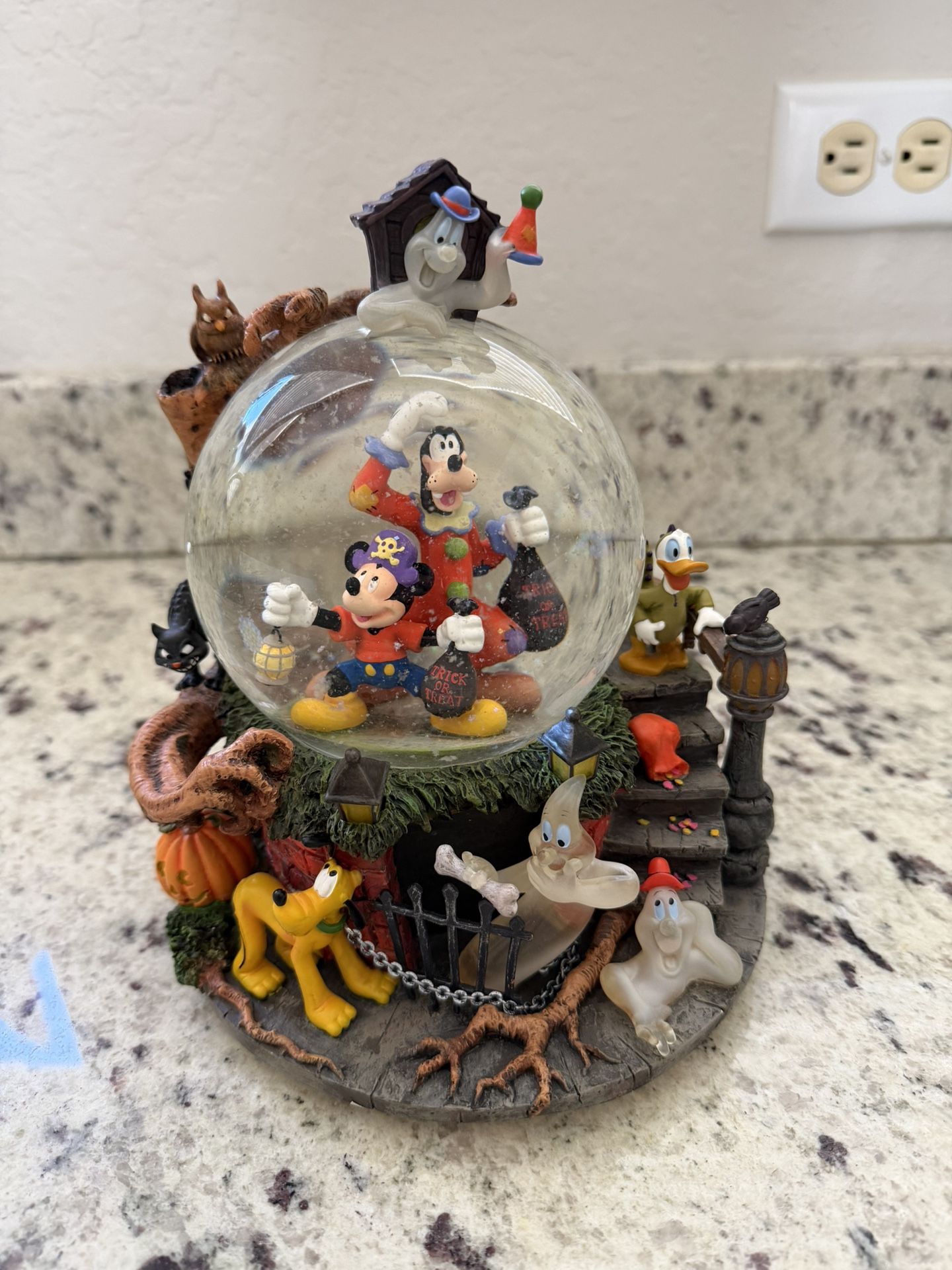 Rare Halloween Light Up Sound Activated Disney Snow globe.