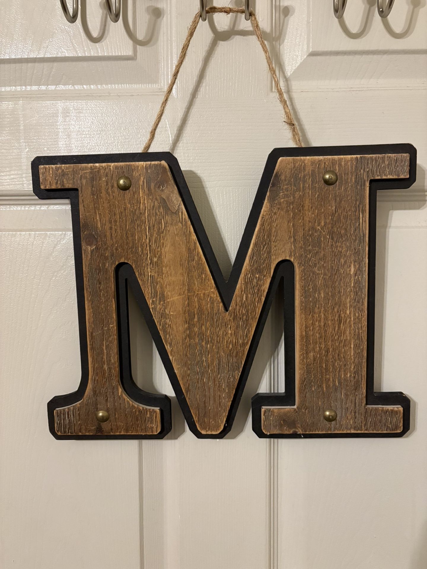 Brown Wooden Letter “M” With Brass Studs