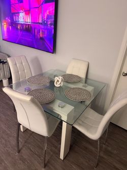Glass table leather chairs