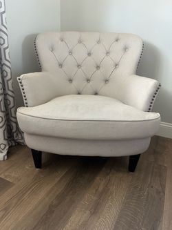 Tufted club chair