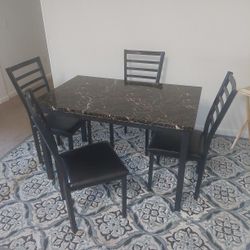 Table and with 4 chairs 