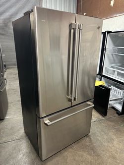 Luxury Counter depth Café with indoor water and icemaker Cafe 23.1 cu.ft. Smart French Door Refrigerator - Stainless Steel Retail price $3269