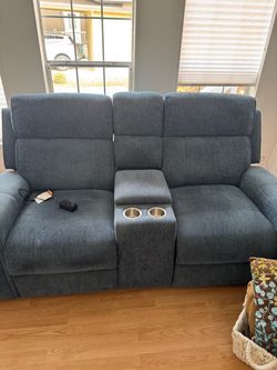 Power reclining loveseat with charging ports