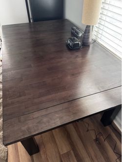 Table with 2-18” self storing leaves