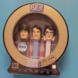 Elvis 3 pc Pez Dispenser set NWT sealed in collector's tin with music CD!

 