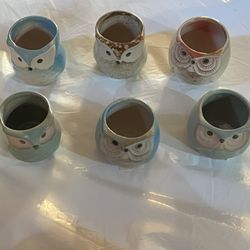 Charming owl-shaped ceramic planters in various colors. Perfect for small plants or succulents.  See pictures 