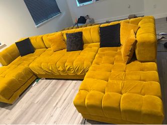 Nice gold sectional with chaise , rug and two  stools