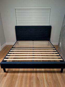 Upholstered  navy blue king size bed Free
