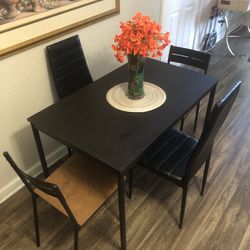 Black dining table set with 4 chairs