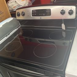 Used GE 4 Burner Glass Top Black And Stainless Steel Range. 1 Year Warranty 