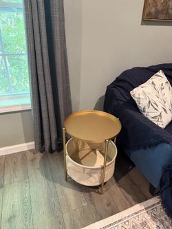 Pair of gold nightstands with canvas baskets