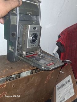 Antique Poloroid Camera And Westinghouse Radio