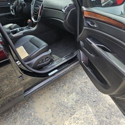 2016 Cadillac Srx. Premium Editiin.dual Sun Roof. Electric Mirrors. Heated And Cooled Steering Wheel. Heated And C ooled Seats. Boise Sterp With C.d M