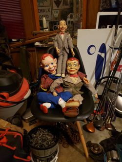 Two ventriloquist  dolls and a pee wee doll.