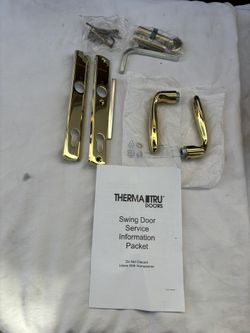 New Therma-Tru Swing Doorhandle.  Polished Brass finish. With lock and keys 