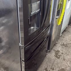 Black Whirlpool Refrigerator With Water And Ice Dispenser