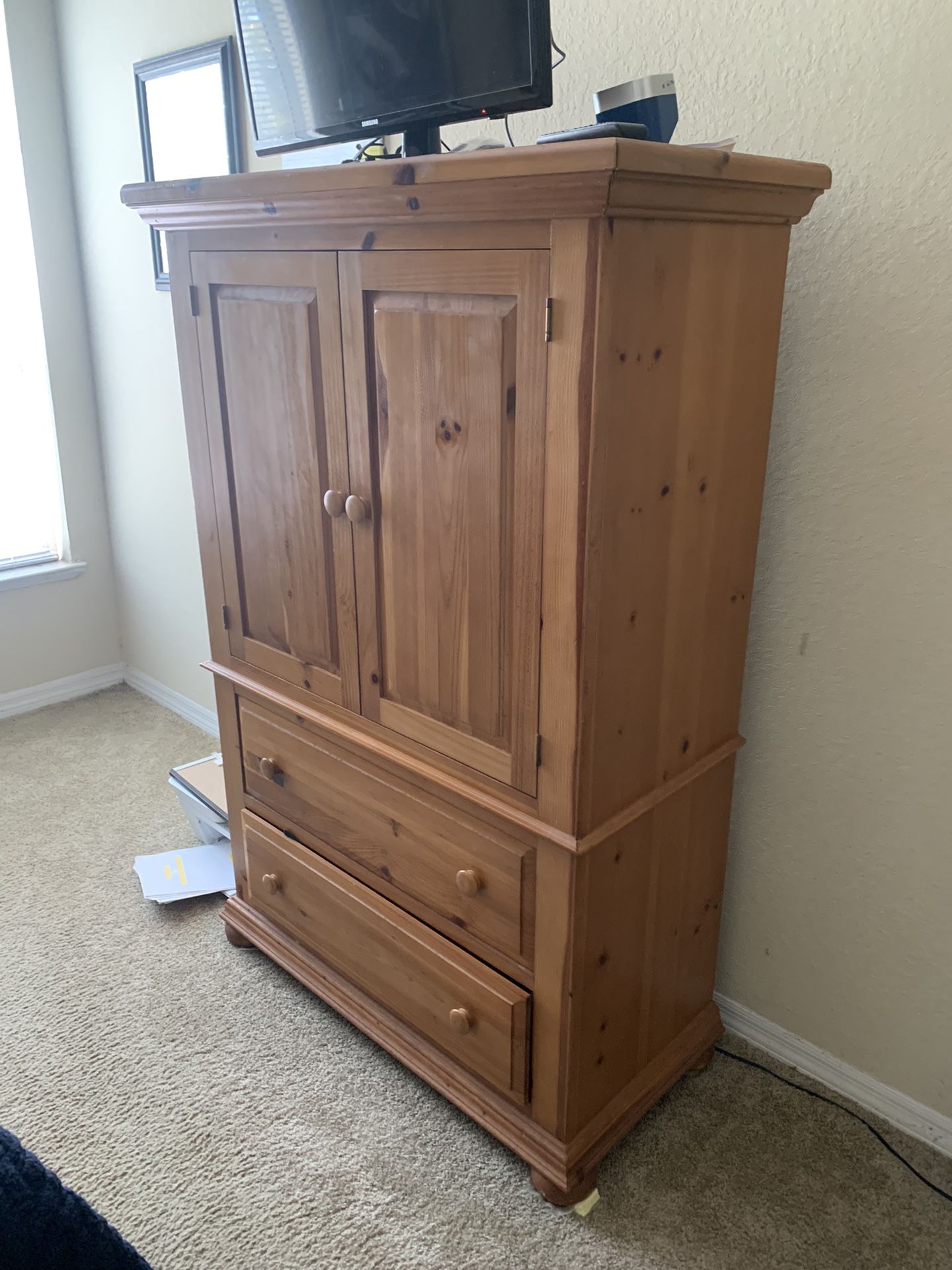 Light Brown Armoire Piece new . 150$ (Tv $ Dog Not Included)