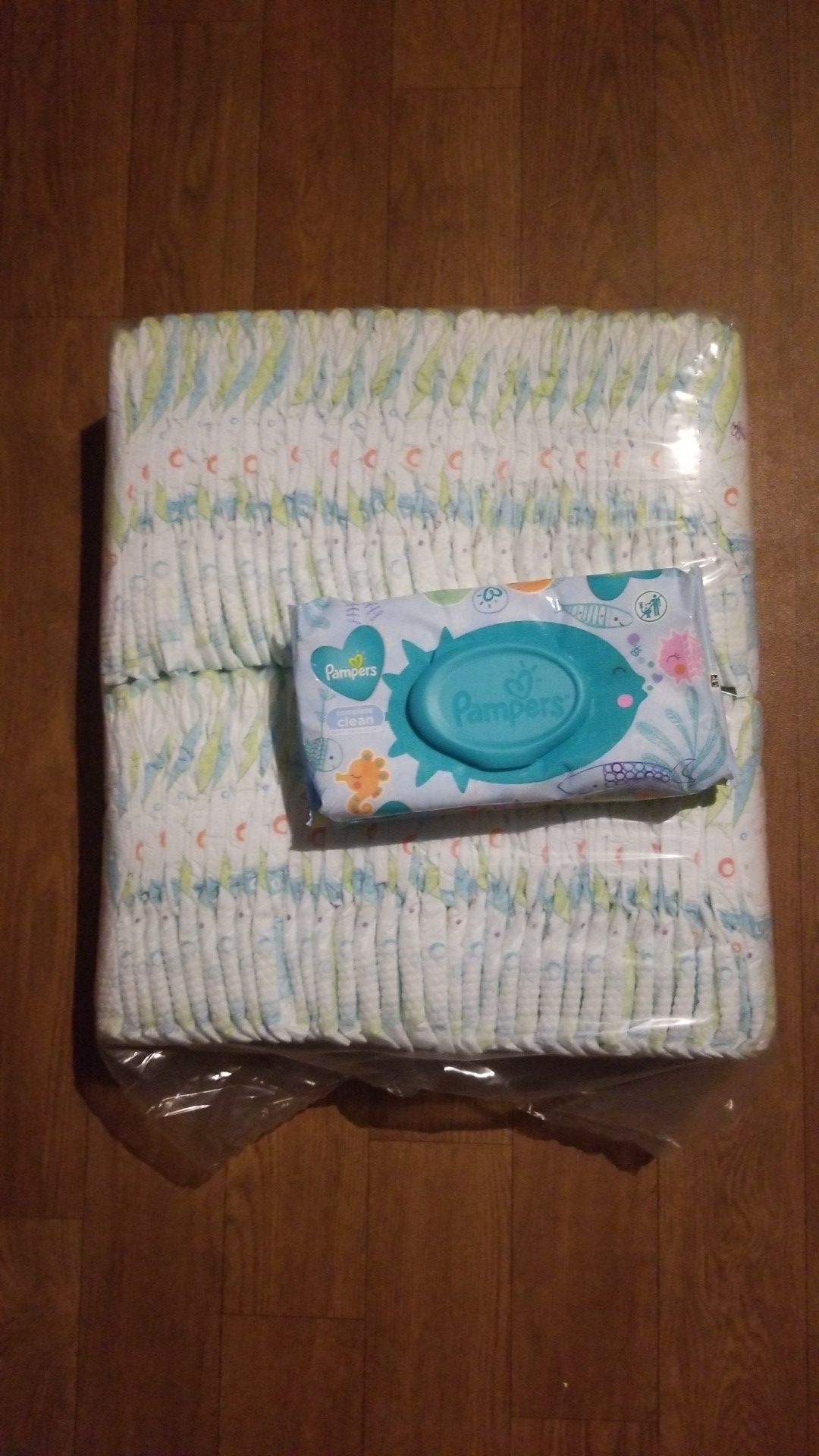 Size 3 Kirkland diapers w/ 1 pack of Pampers wipes