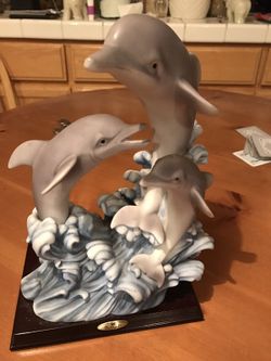 de capoli dolphin statue