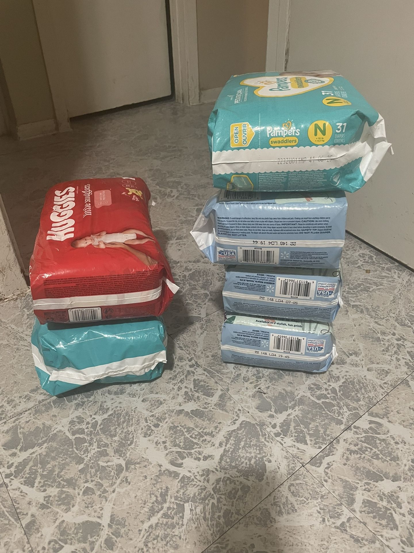 4 Packs Of Newborn &2 Packs Of Size 1