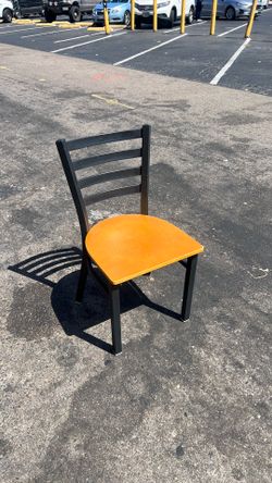 Multiple restaurant seats/chairs.