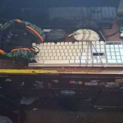 Keyboard And Mouses And A Pair Of Headphones 
