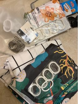 Free shower curtains and hooks.