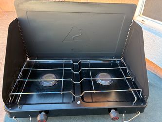 OzarkTrail outdoor two burner camp stove 20,000 BTU sells at Walmart for $94 plus tax. Like new.